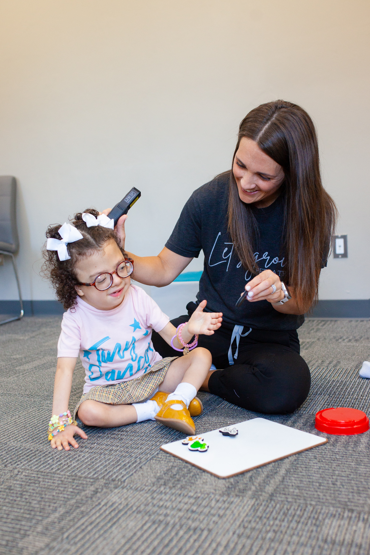 Red light laser therapy device being applied to a child during a treatment session.
