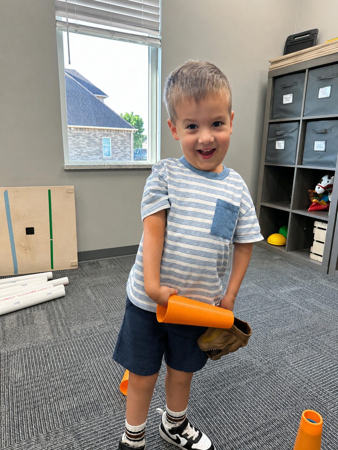 Luke smiling in the therapy gym today.